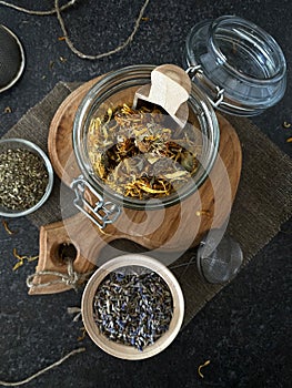 Calendula flowers in a glass jar. Useful herbal tea to boost immunity