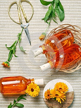 Calendula hydrosol for cleans, softens, stills and heals skin. Eco friendly body care. photo