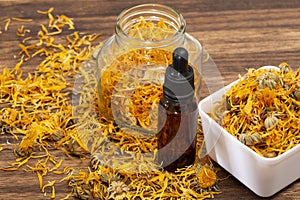 Calendula officinalis - Calendula Oil In Dark Cosmetic Dropper photo