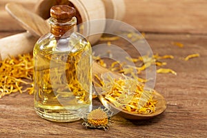 Calendula officinalis - Calendula Oil In A Glass Bottle photo