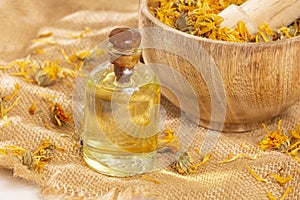 Calendula officinalis - Calendula Oil In A Glass Bottle photo