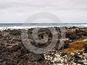 Caleta del Mojan Blanco, white sand and lava rocks