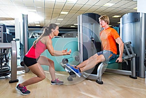 Calf extension man at gym exercise machine
