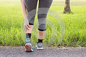 Calf muscle in pain with cramp,Woman suffering from pain in leg injury after sport exercise running jogging and workout