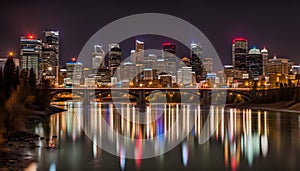 Calgary skyline at night with Bow River and Centre Street Bridge photo