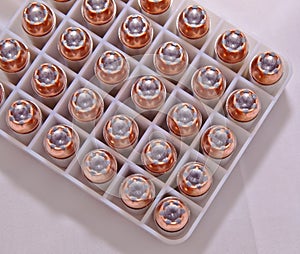 .40 caliber hollow point bullets lined up in a plastic case