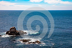 California coastline along US one. Rocky shores, majestic sky and blue waters