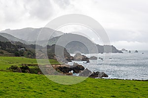 California Landscape with Cliffs and Pacific Ocean in Background next to California State Route 1