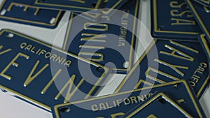 California license plates custom names rotate on white surface 4K