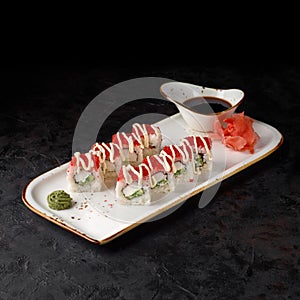 California Maki Sushi with Masago - Roll made of Crab Meat, Avocado, Cucumber inside.