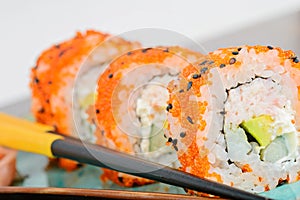 California maki sushi with orange masago