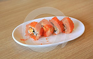 California Maki Sushi Rolls on wood table background. Traditional Japanese food