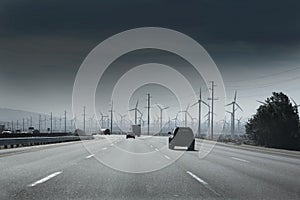 California road with electric windmills aerogenerators photo