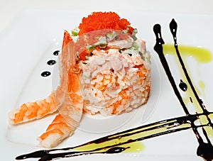 California salad mix of cocktail shrimp, salmon, avocado on a pillow of rice with tobiko, tiger shrimpwith California sauce