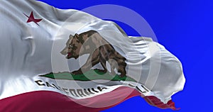 California State flag waving isolated on blue background