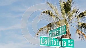 California street road sign on crossroad. Lettering on intersection signpost, symbol of summertime travel and vacations. USA