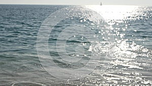 California summertime beach aesthetic, blurred defocused water wave. Shiny sun track and sunlight. Santa Monica pacific ocean