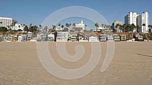 California summertime beach aesthetic, sunny blue sky, sand and many different beachfront weekend houses. Seafront buildings, real