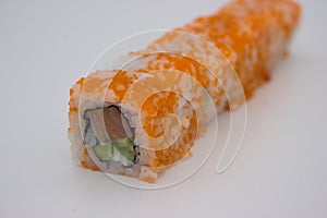 California Sushi Roll with Masago on a White Background