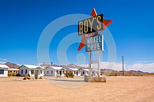 Roy`s motel and cafe with vintage neon sign on historic Route 66 road in Californian desert.