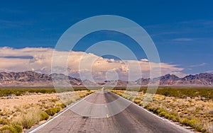 California, USA - road leading to the mountains