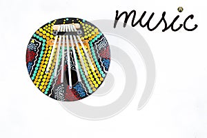 Calimba, colorful circle music instrument, with ??music ??inscription on white background