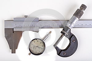 Caliper, micrometer and sensor. Measuring tools used in the workshop