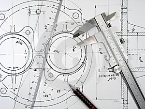 Caliper, ruler and pencil on technical drawings.