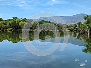 caliph blue skies reflected in clear waters on a sunny day