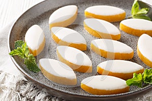 Calissons French glazed almonds bonbons with white icing closeup. Horizontal