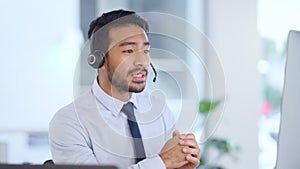 Call center agent consulting a buyer via video call in an office. A young friendly sales man talking to a client in a