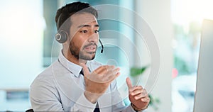 Call center agent consulting a buyer via video call in an office. A young friendly sales man talking to a client in a