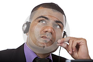 Call Center Agent looks contemplative