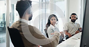 Call center, agent and teamwork with discussion at desk for telemarketing, sales planning or support. Customer service