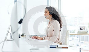 Call center, computer and happy consultant woman in telemarketing office for online assistance or help. Contact us, desk
