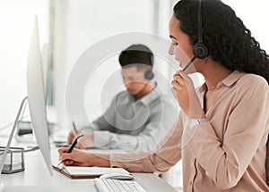 Call center, computer and woman writing notes in office for telemarketing online consultation. Communication, customer