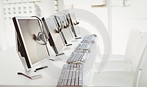 Call center computers and headsets