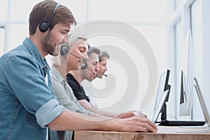 Call center consultants use computers to work with clients