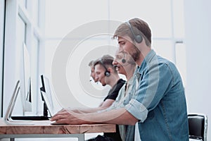 Call center consultants use computers to work with clients
