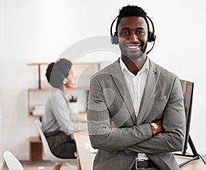 Call center, customer service and crm consultant wearing headset and looking happy in telemarketing company. Portrait of