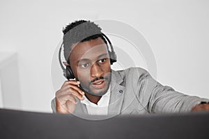 Call center, customer service and crm representative wearing headset while consulting with customer in telemarketing