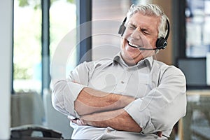 Call center, customer support and man laugh in office for joke, humor and friendly sales service. Communication