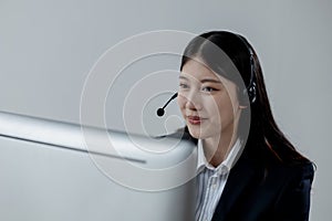 Call center employee talking with customer through headset, The operator is providing customer service by phone, Customer service