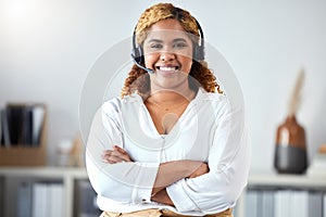 Call center, happy and smile of a woman in customer service or telemarketing consultant with crossed arms at the office