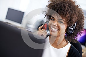 Call center, happy and woman in office with headset working on online telemarketing consultation. Smile, customer