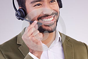 Call center headset of happy man isolated on a white background telemarketing, telecom or global support. Asian