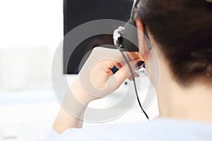 Call center. Hotline work, telephone consultation. a telephone service employee talks to the customer through a headset.