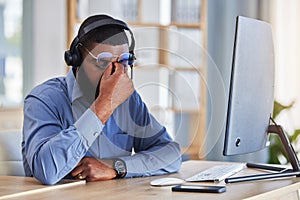 Call center, man and headache, pain or stress for communication mistake, error and sales crisis on computer. Agent