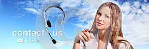 Call center operator with headset and contact us text