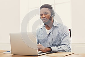 Call center operator man with headset working